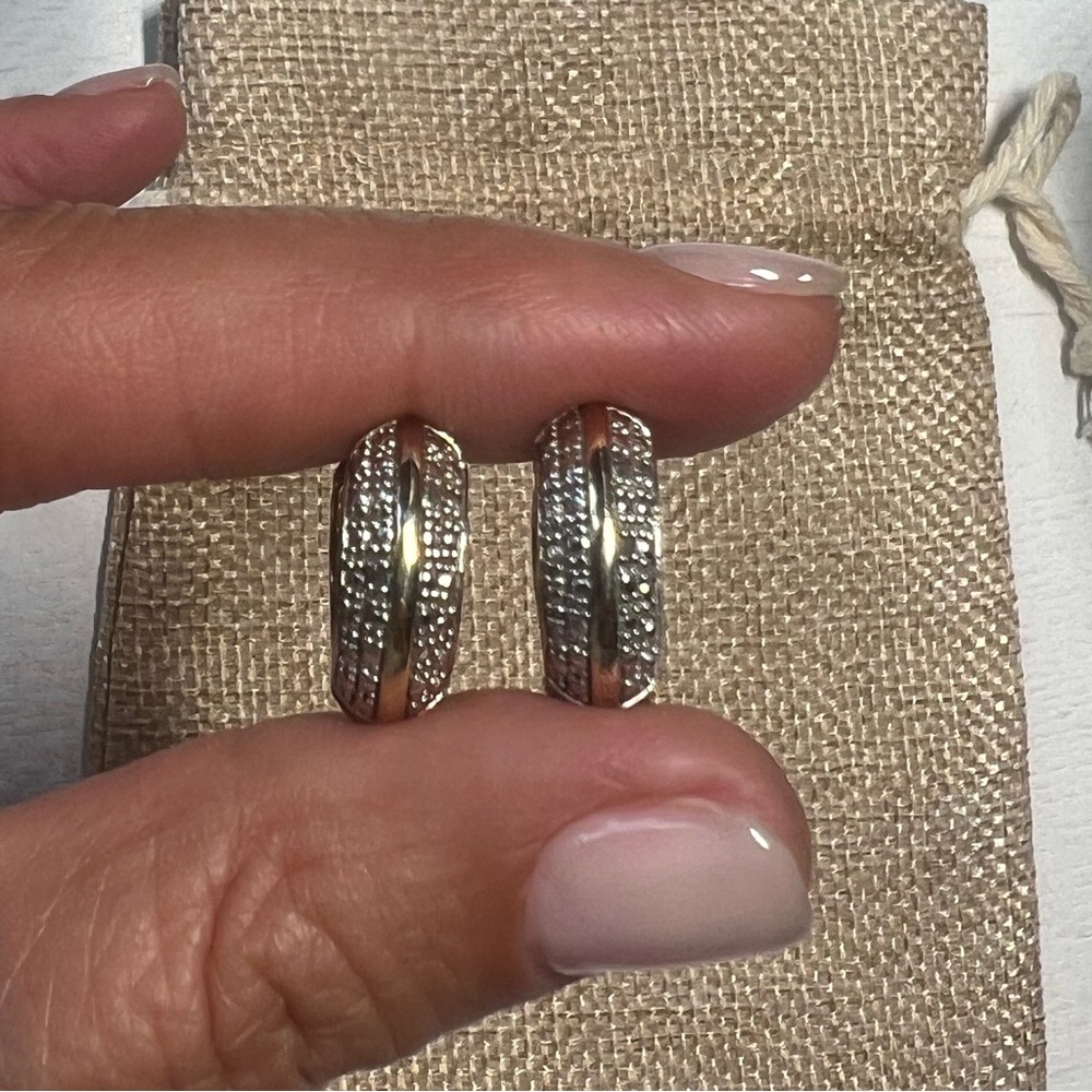 Sterling silver plated gold huggies with zirconiums.